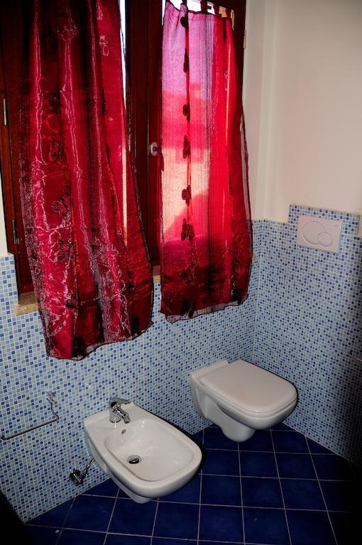 I Portici Appartamenti مارينا دي غروسيتو الغرفة الصورة